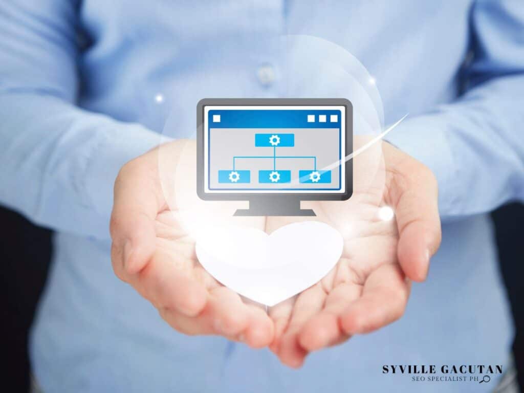Hands holding a graphic of a computer screen displaying a website structure.