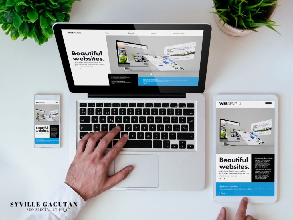 Laptop, tablet, and phone displaying a web design site.