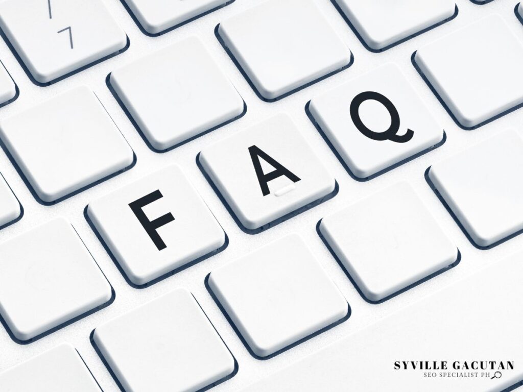 Keyboard keys labeled "FAQ" on a white keyboard.