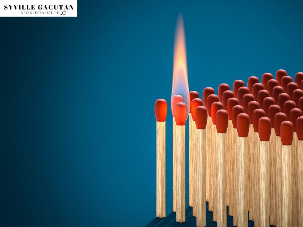 A single match burns among the others.