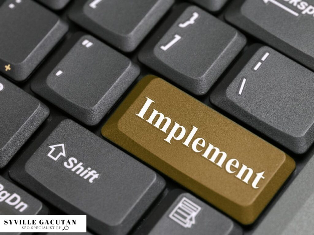 The word "Implement" on the keyboard key.