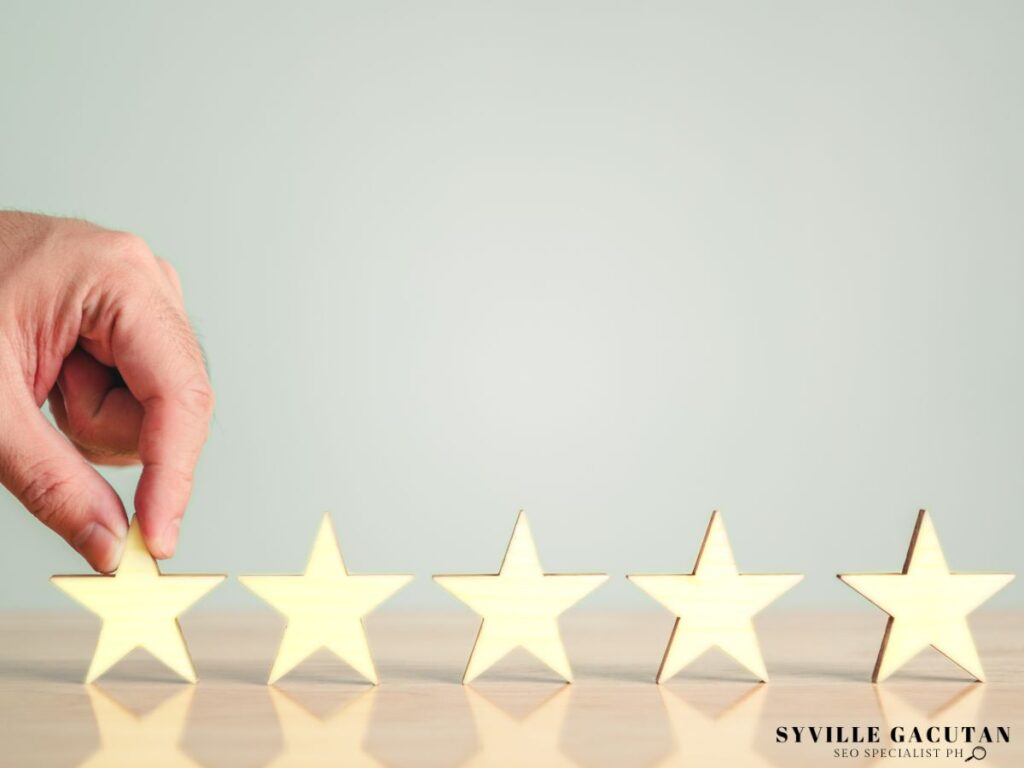A hand placing a star on the table.