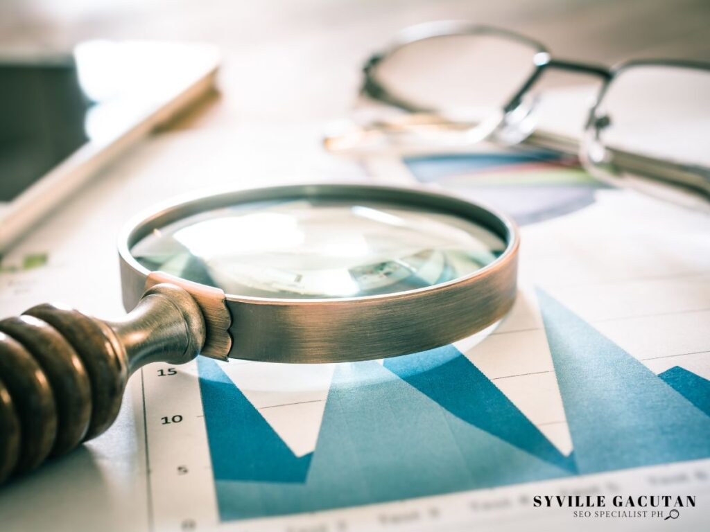 A magnifying glass placed on a chart,.