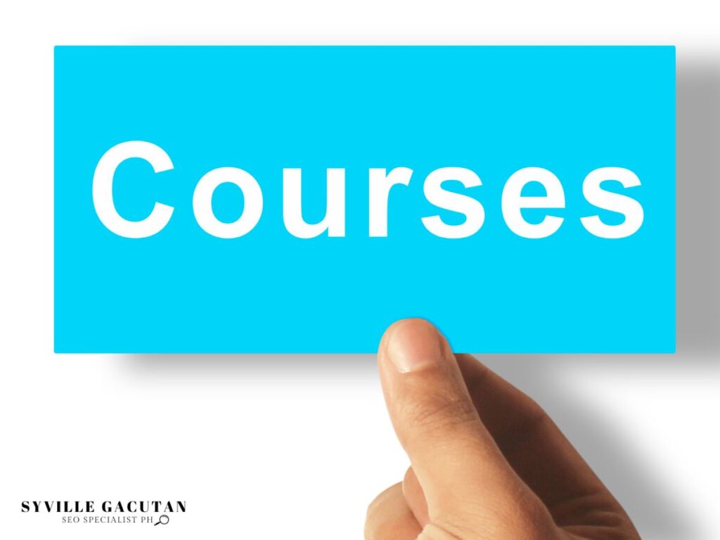 Hand holding a blue card labeled "Courses."