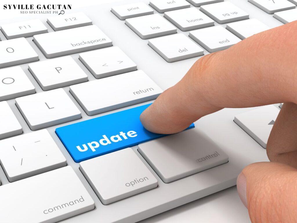 Finger pressing "update" key on keyboard