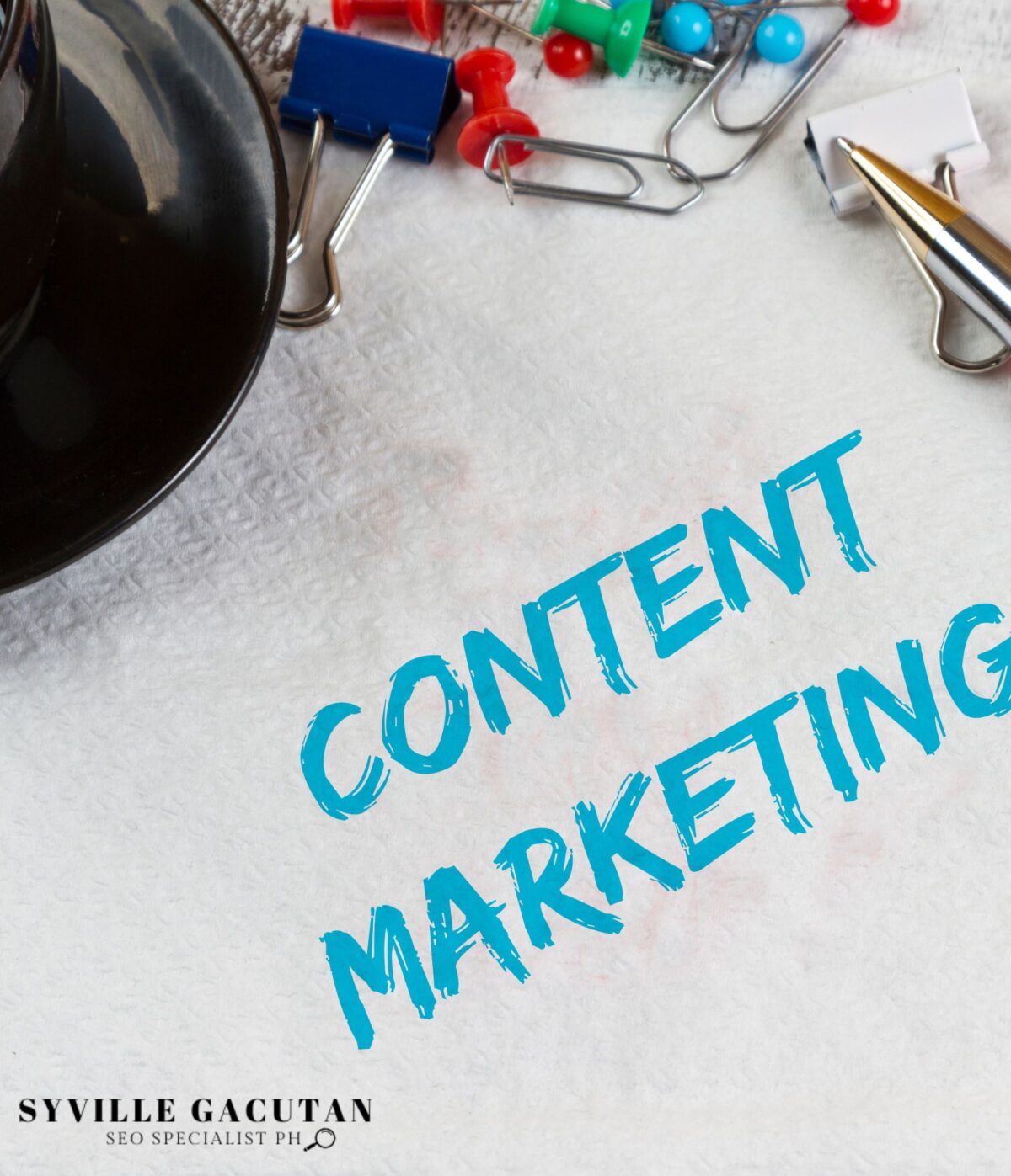 "CONTENT MARKETING" text surrounded by office supplies