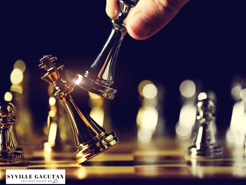 Chess pieces with one king knocking over another.