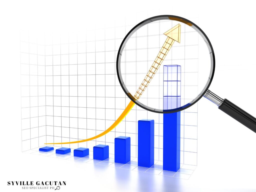 Magnifying glass highlighting a graph with an upward trend.