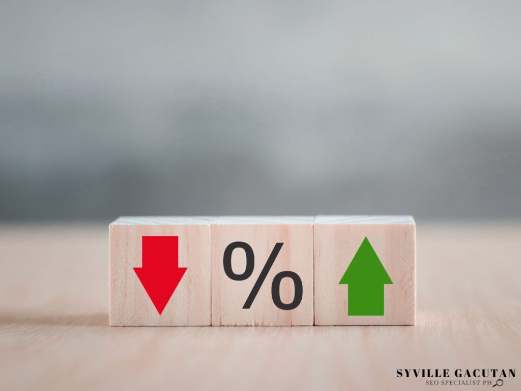 Wooden blocks with red arrow, percentage symbol, and green arrow symbols.