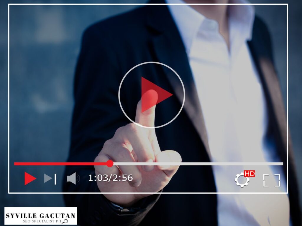 A finger pressing a play button on a video player screen.