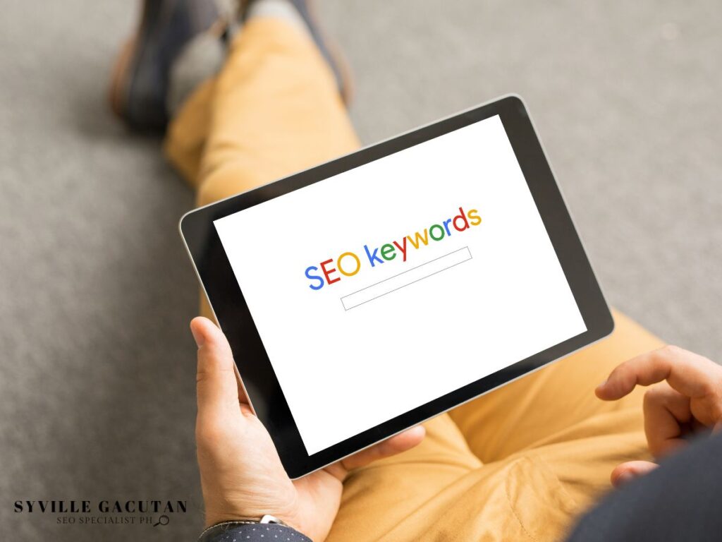 Tablet displaying "SEO Keywords" in search bar.