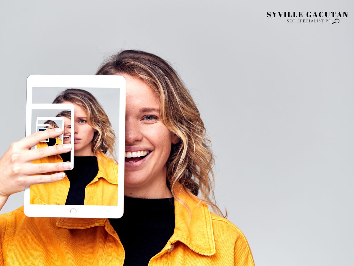 Woman holding a tablet with repeated reflections.