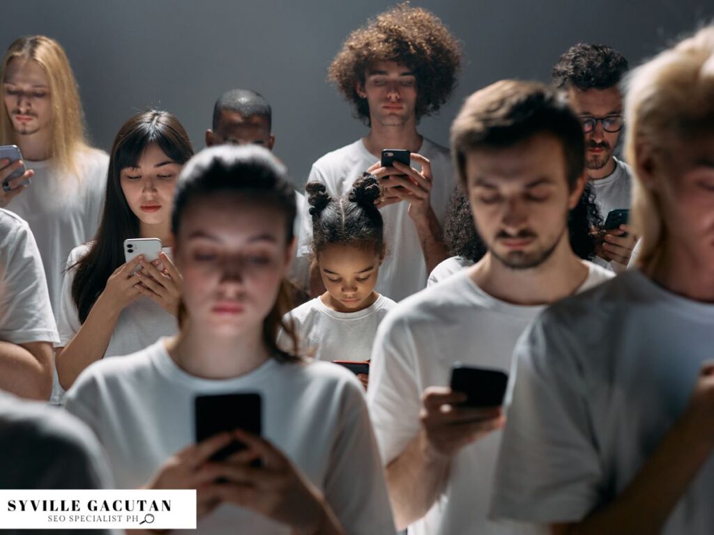 A crowd of people focused on their smartphones.