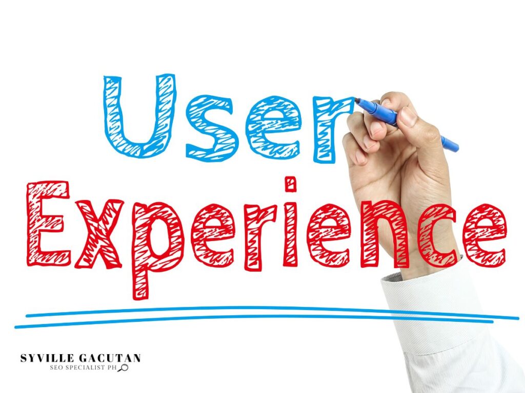 A hand writing "User Experience on a clear board"
