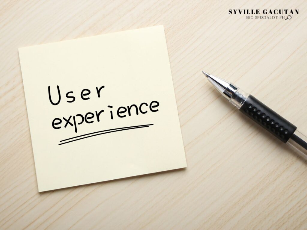 Sticky note with "User experience" written in black ink.