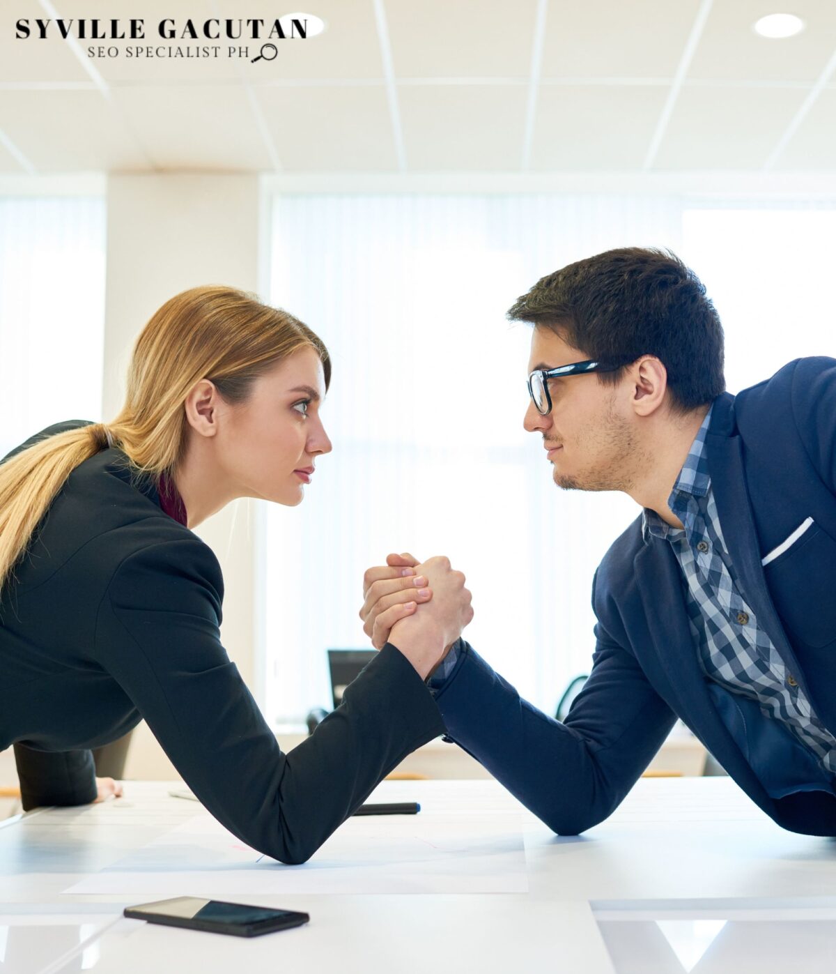Two professionals arm wrestling.