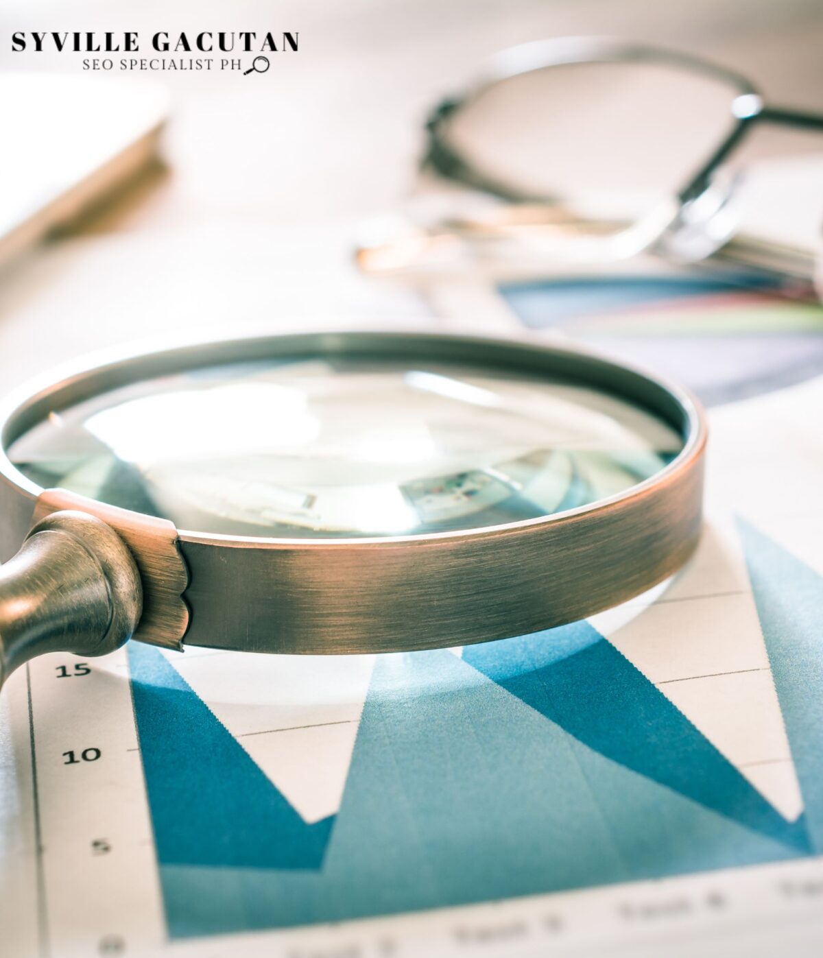 A magnifying glass placed on the paper with graphs.