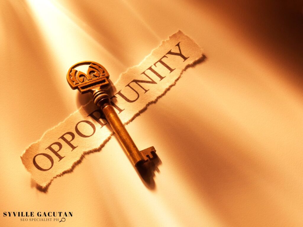 A golden key resting on torn paper with the word "OPPORTUNITY."