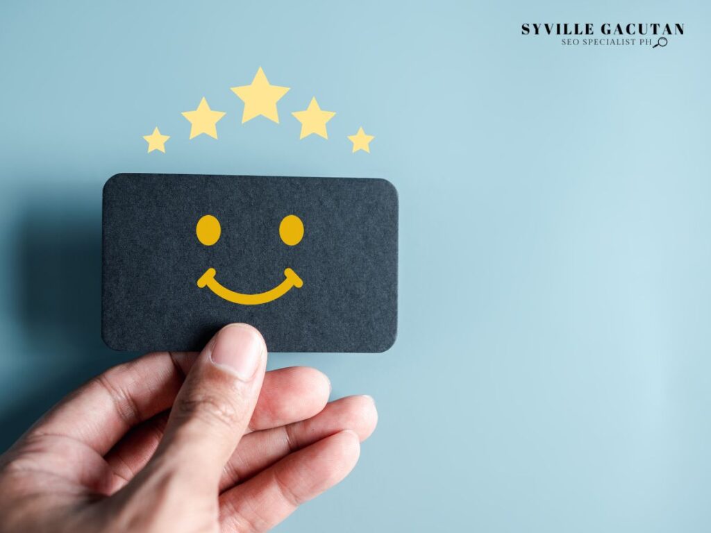 A card with a smiling face and five stars.