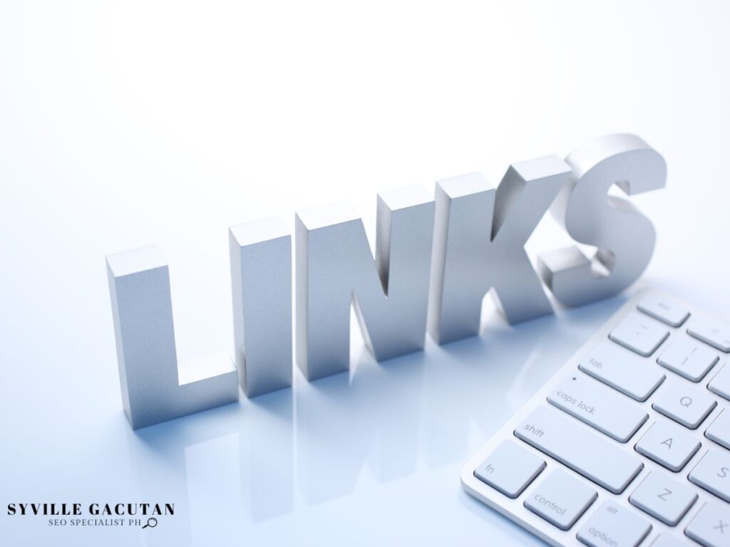 The word "LINKS " in silver letters next to a white keyboard.