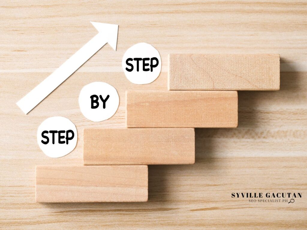 A wooden block staircase labeled "Step by Step" with an upward white arrow.