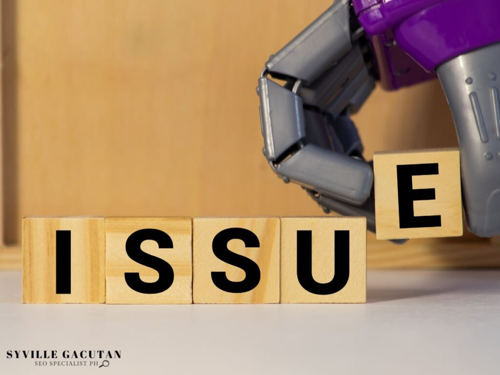 Robot hand grabbing a peiace of block spelling "ISSUE" 