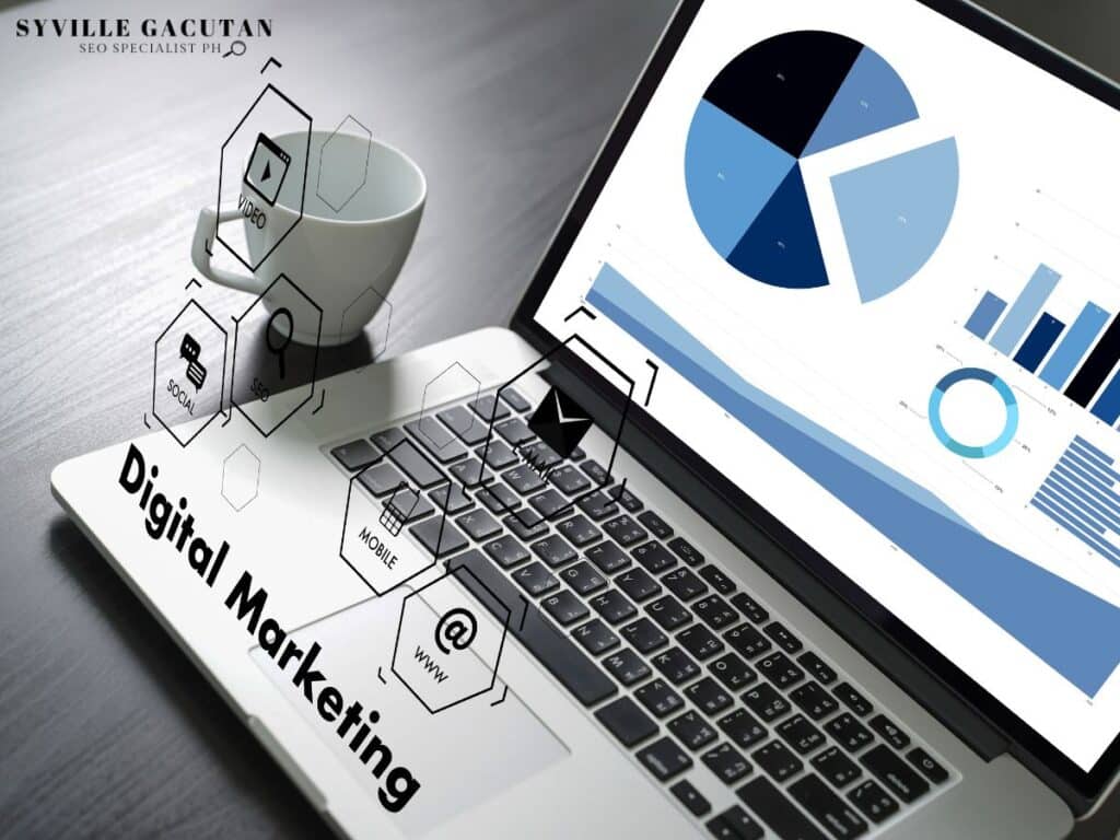 Laptop displaying charts with digital marketing icons floating above.