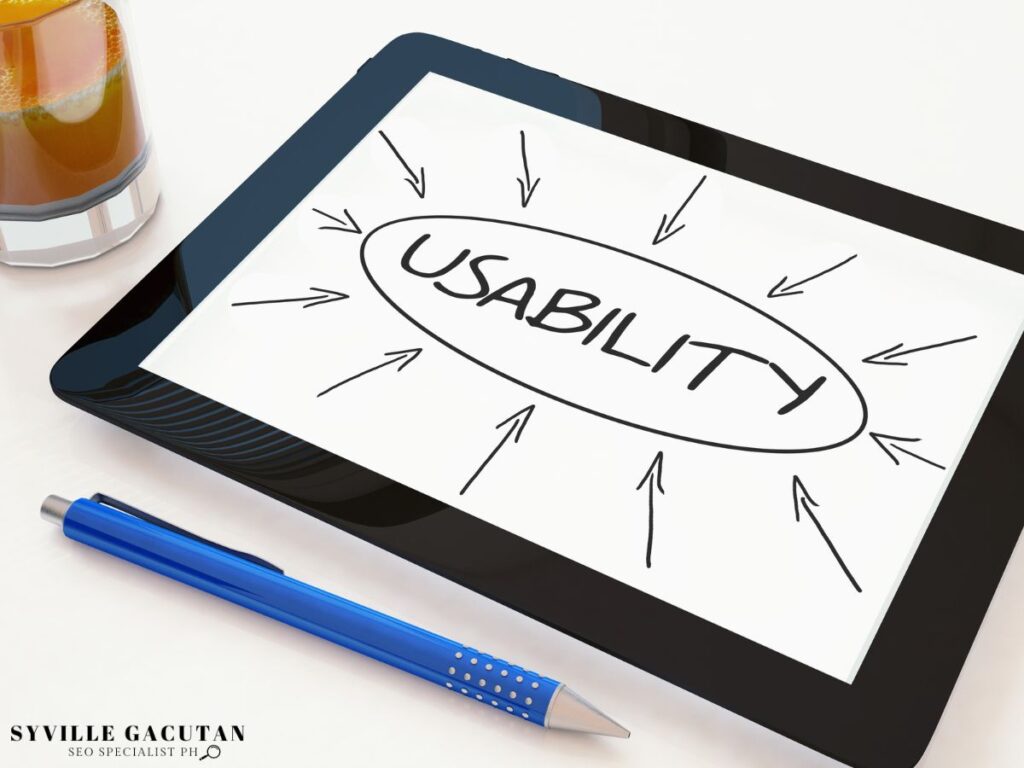 A tablet displaying the word "Usability" with arrows pointing toward it.