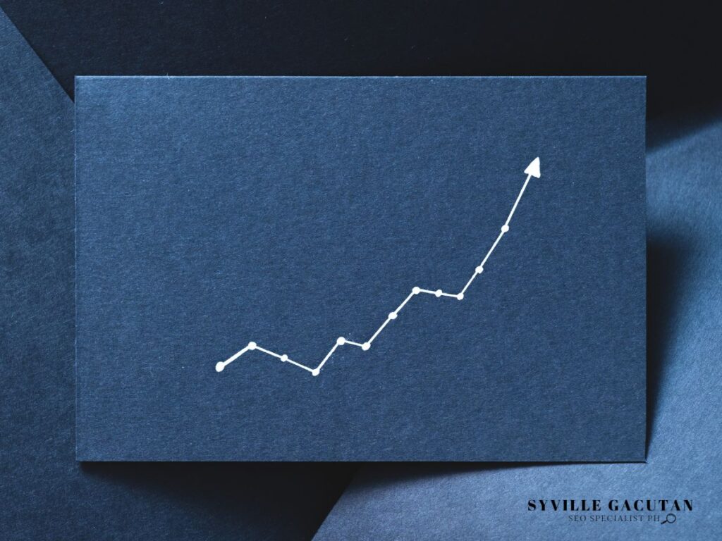 A rising line graph on a dark card.