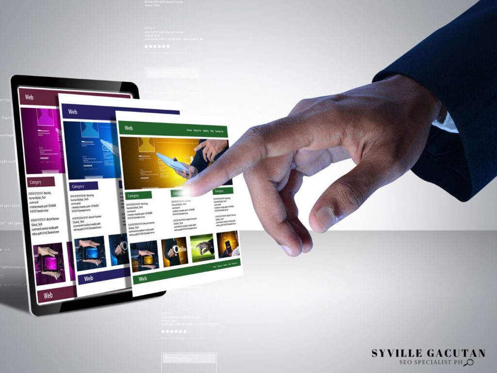 Hand pointing at tablet screen displaying multiple web page layouts.