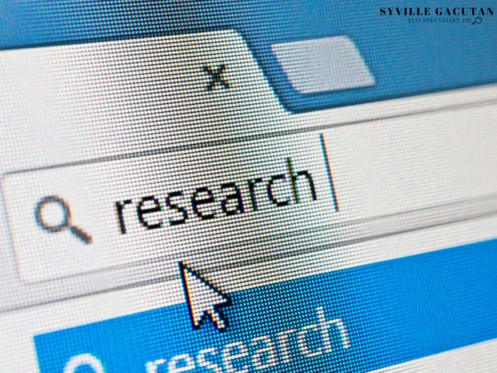 Close-up of a search bar with the word "research" being typed.