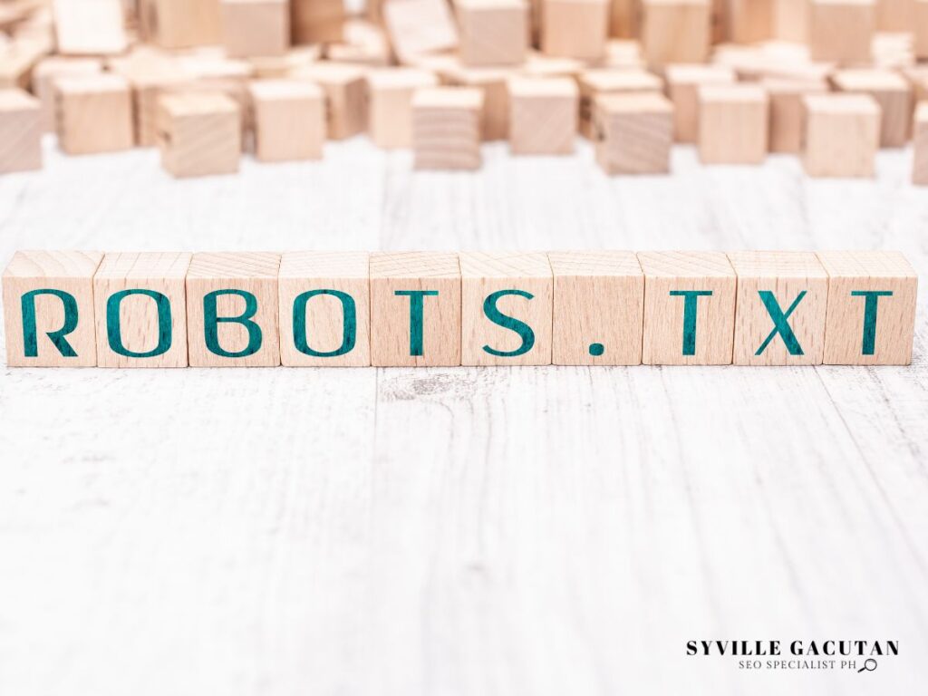 Wooden blocks spelling "ROBOTS.TXT".
