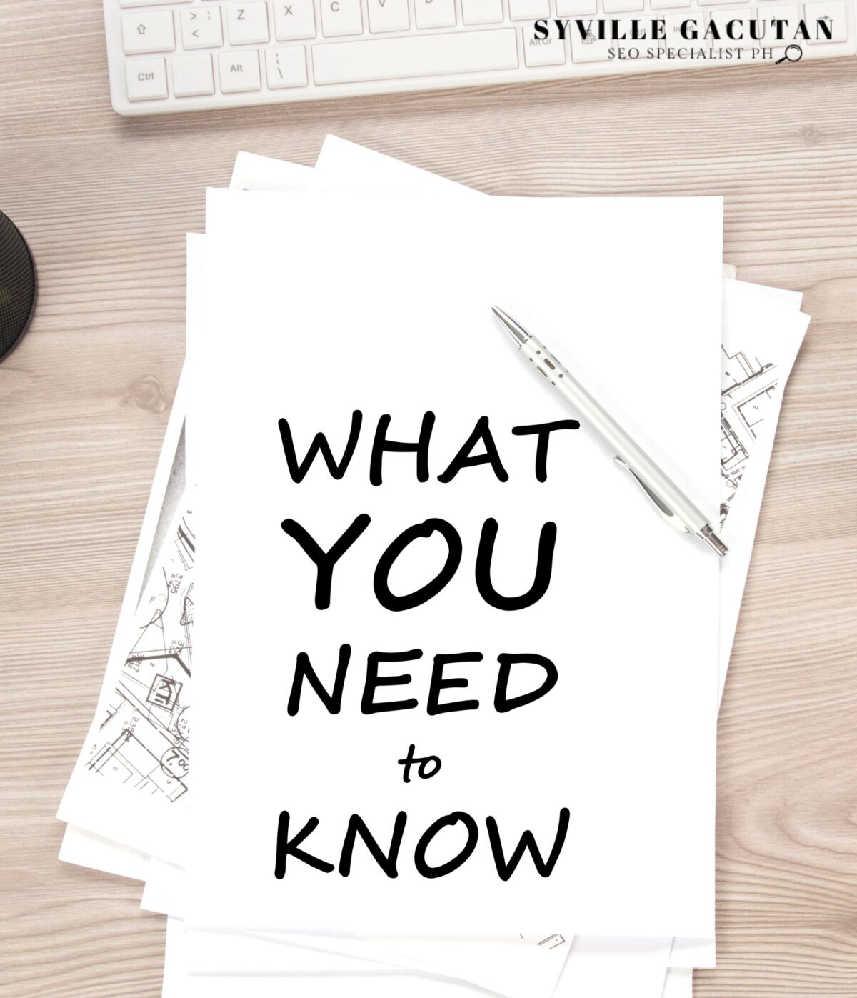 Papers with "WHAT YOU NEED TO KNOW" on a desk