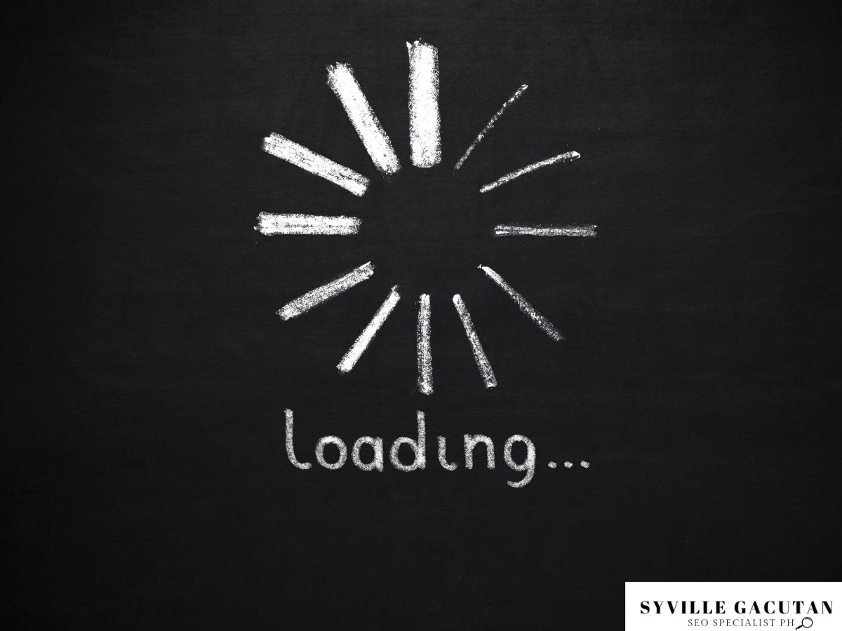 Chalkboard with "Loading..." symbol drawn in white.