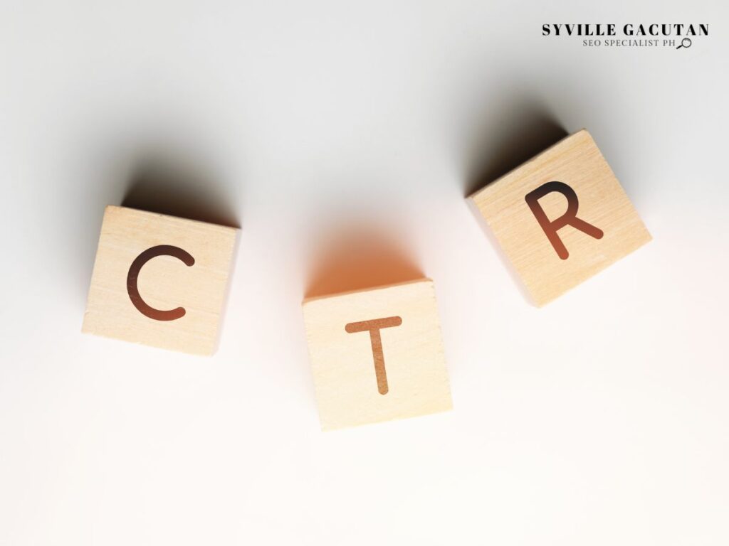 Wooden blocks with letters 'CTR' on a white surface.