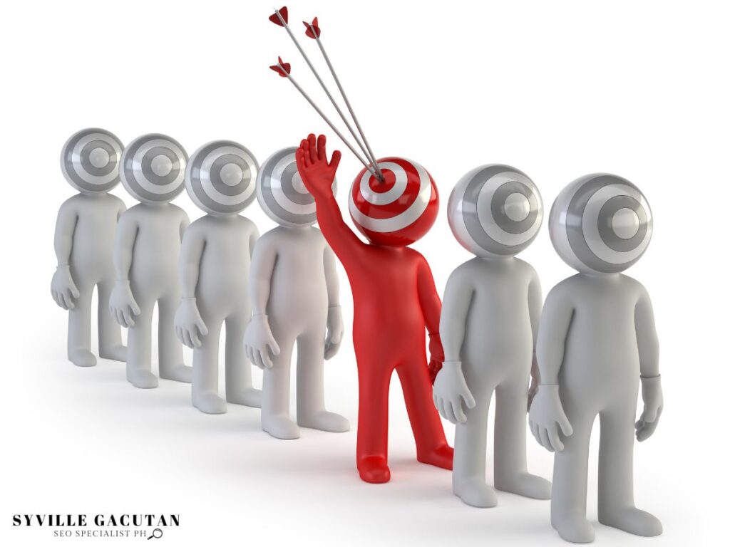 A red human figure with a target head raising its hand with three arrows on its head. 