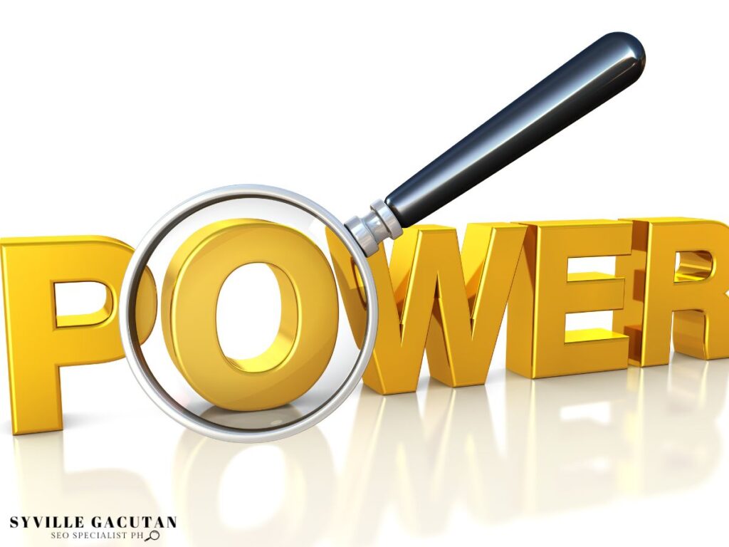 Magnifying glass focusing on the word POWER in bold gold letters.