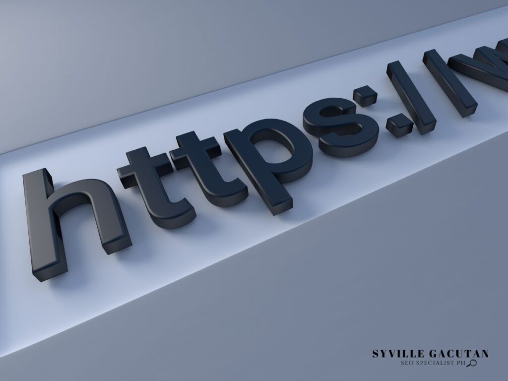 Close-up of HTTPS in black 3D letters on a gray surface.