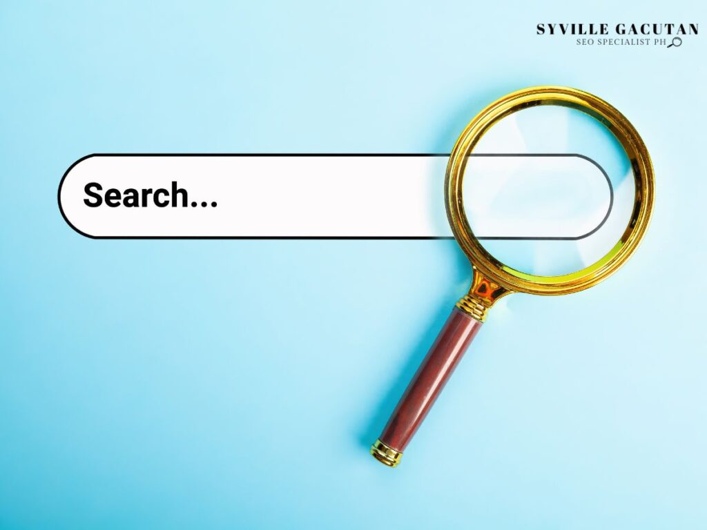 A magnifying glass next to a searchbar.