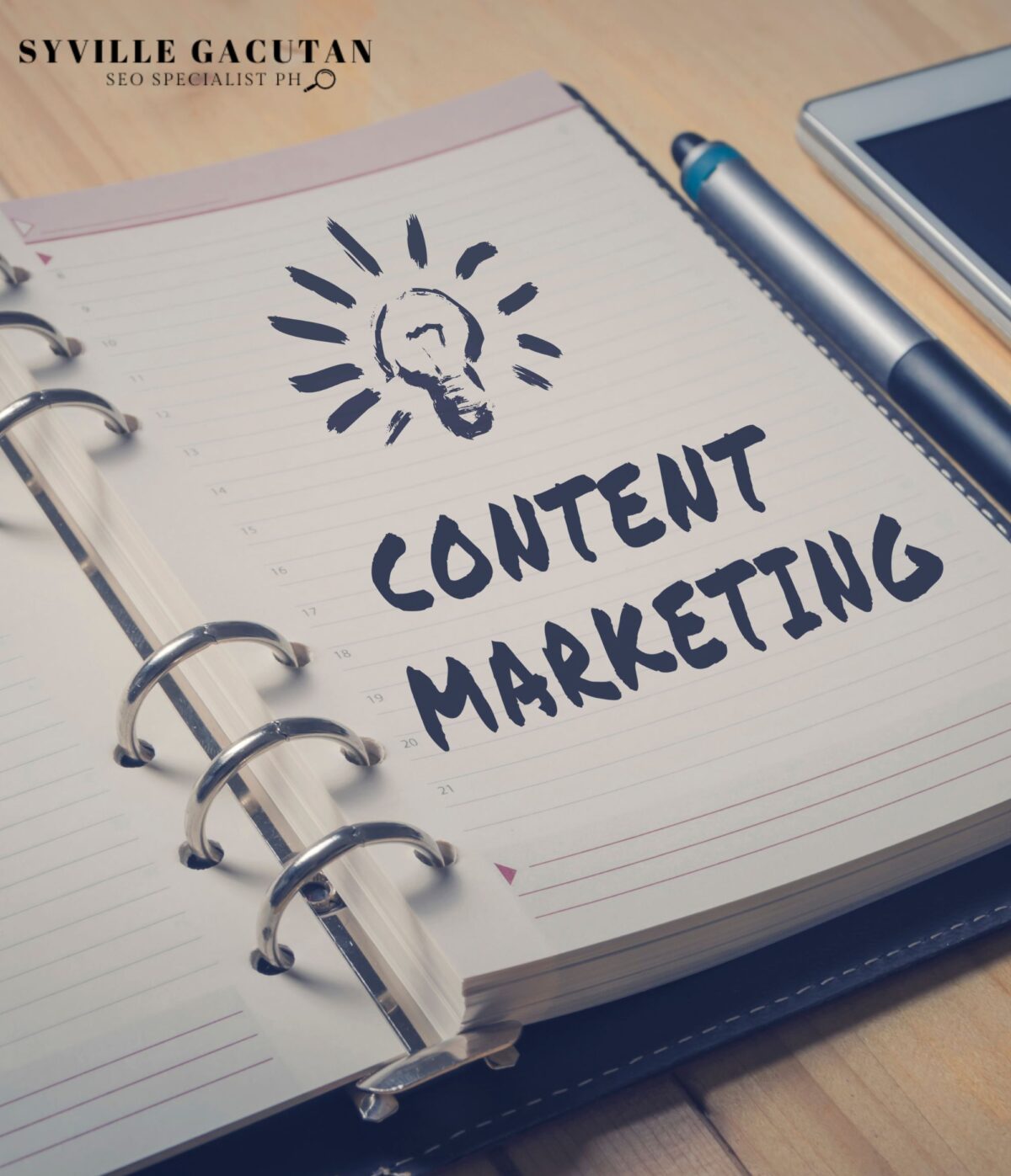Notebook with "CONTENT MARKETING" and a lightbulb doodle