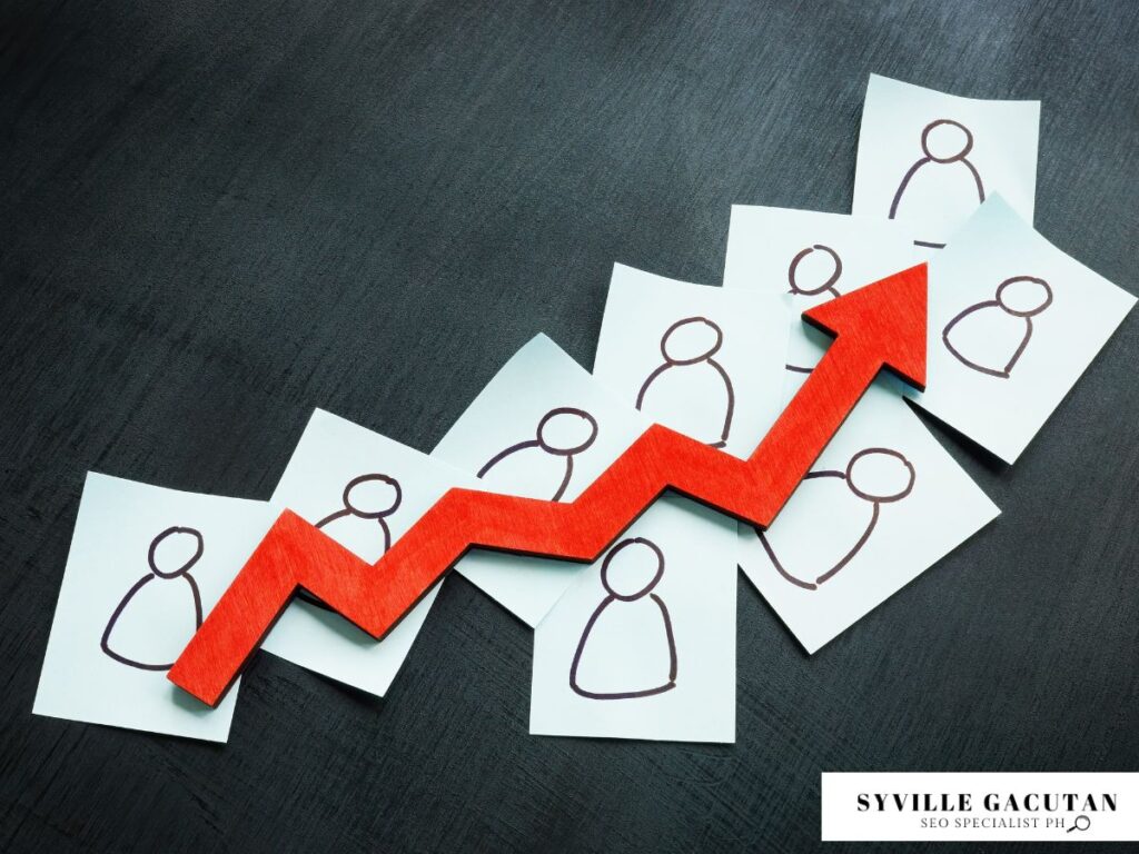 An upward red arrow increasing over stick figure drawings of people.
