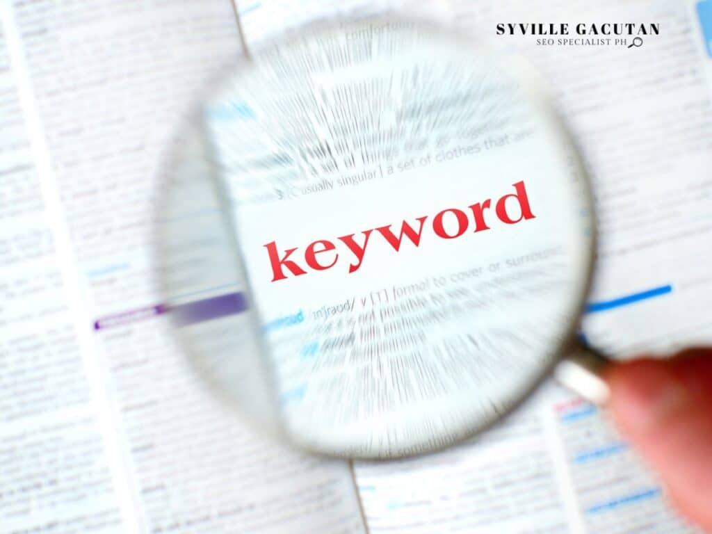 A magnifying glass focused on the word "keyword" in the book.