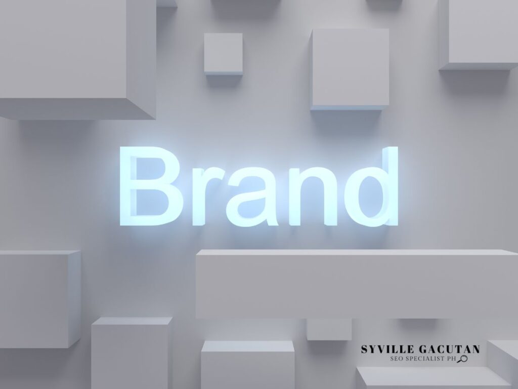 The word "Brand" illuminated in white on a minimalist gray background with geometric shapes.