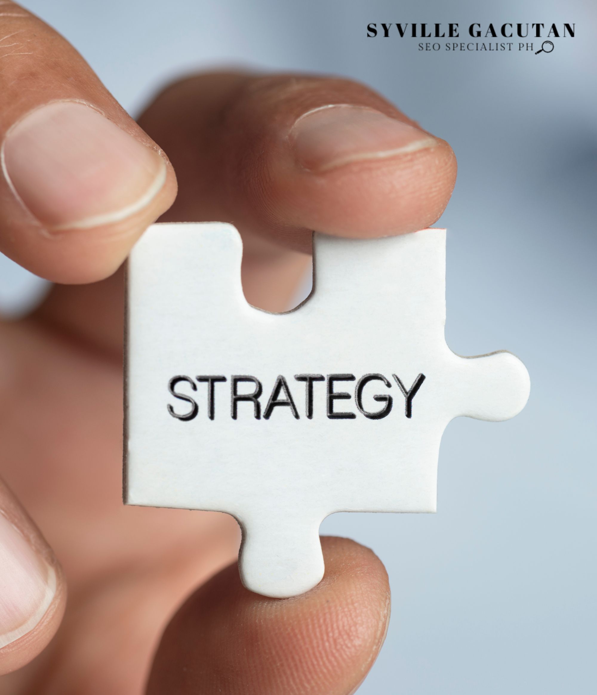 Hand holding a puzzle piece labeled "Strategy."