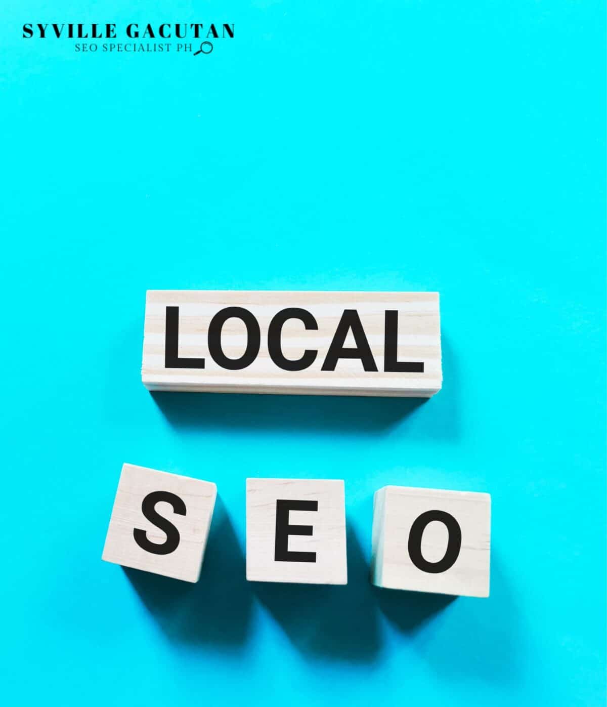 Wooden blocks spelling "LOCAL SEO" on a bright blue background.