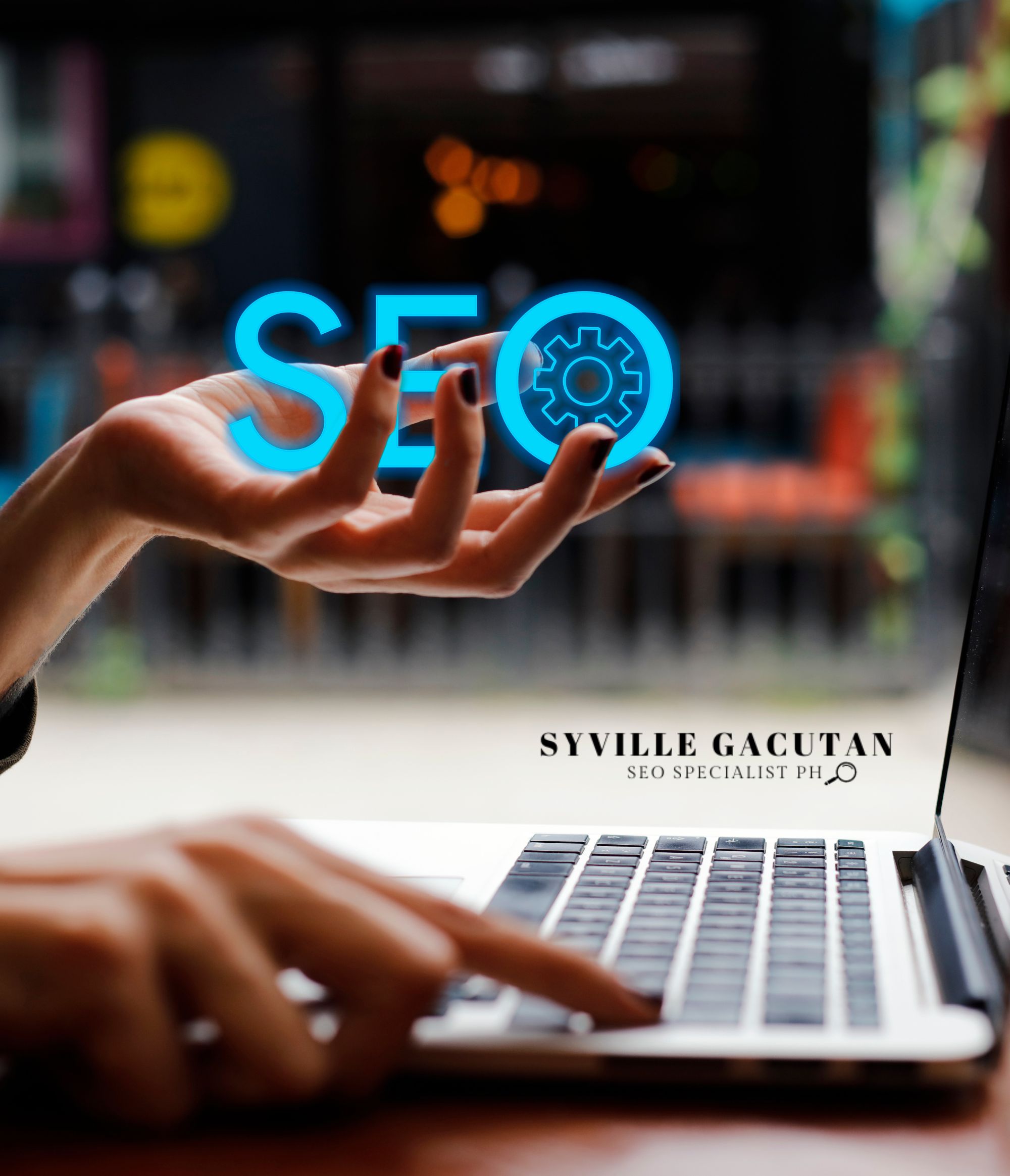 A hand holding "SEO" text with a settings icon over a laptop.