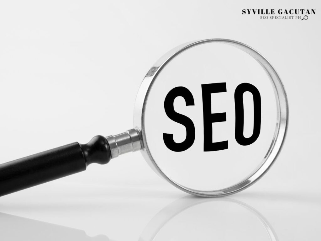 Magnifying glass highlighting the word "SEO" on a plain white background.