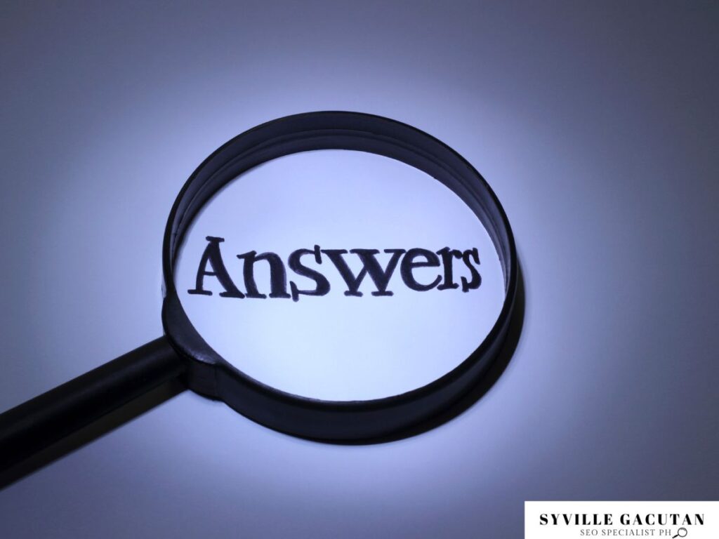 Magnifying glass highlighting the word "Answers" on a lit background.