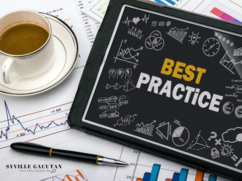 Tablet displaying "BEST PRACTICE" with business doodles, coffee cup and charts on desk.