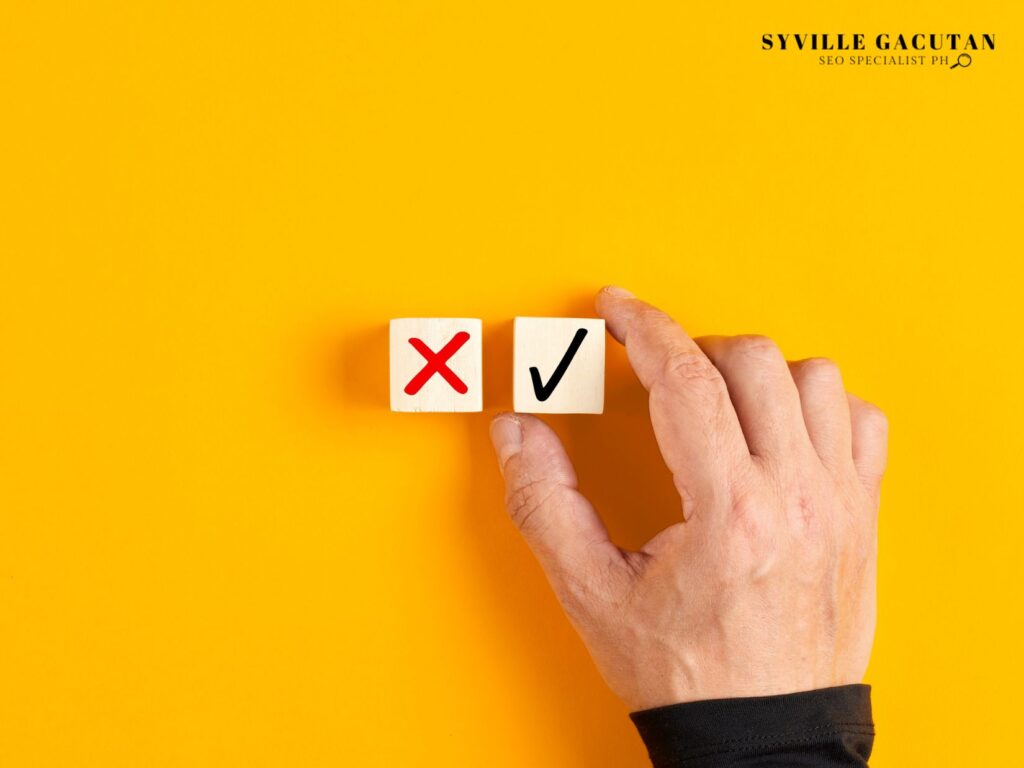 Hand placing white cubes with red X and black checkmark symbols on yellow background.